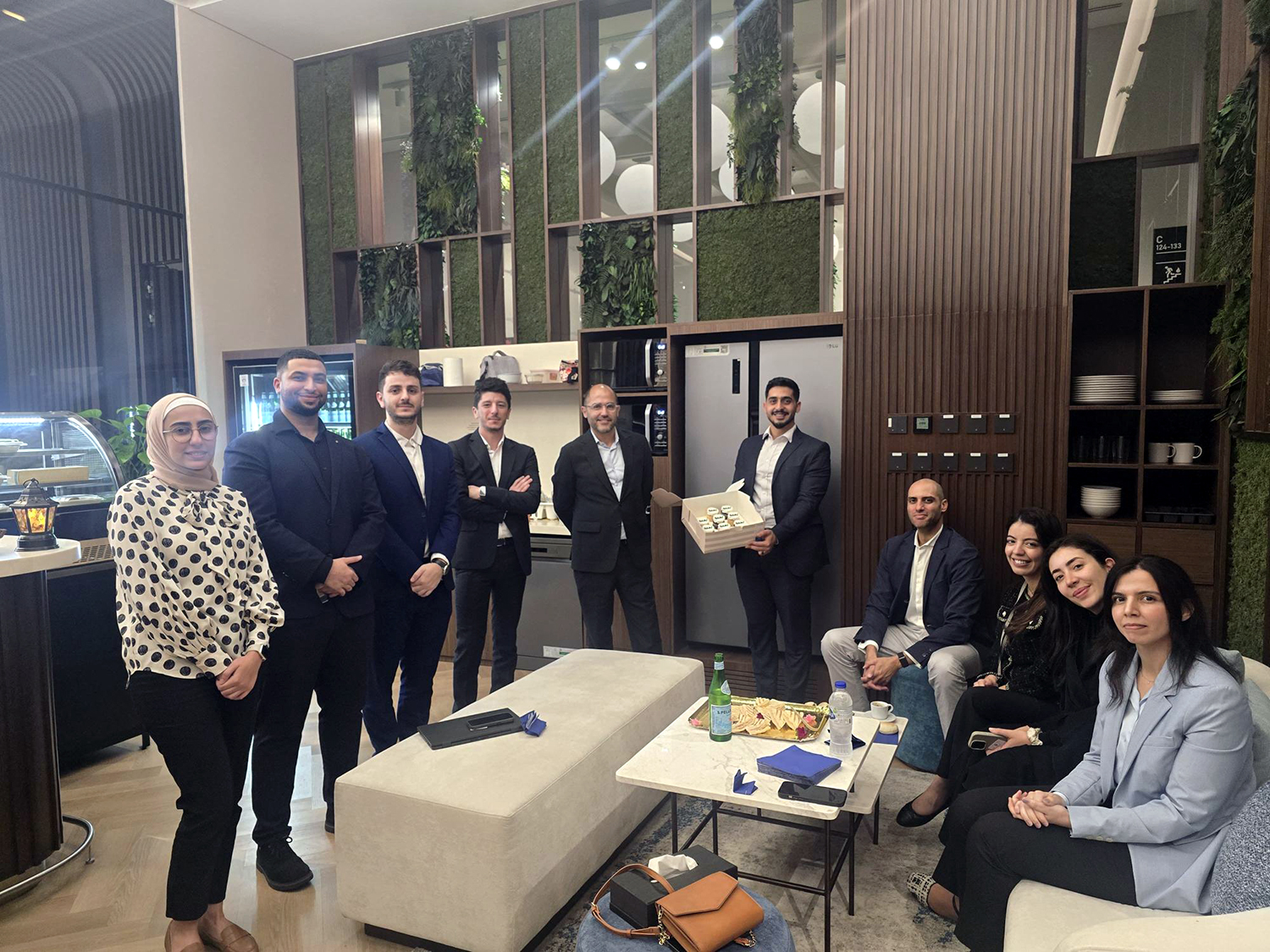 Members of Sia celebrate the office milestone in Abu Dhabi